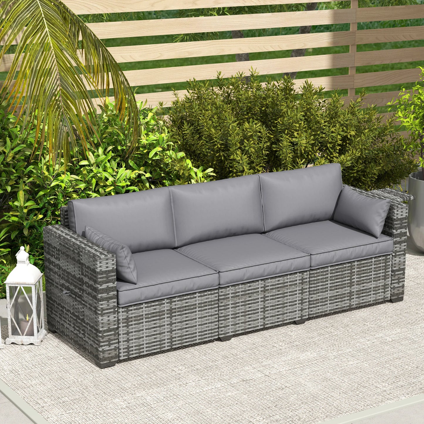 Gray PE rattan patio sofa with arm trays