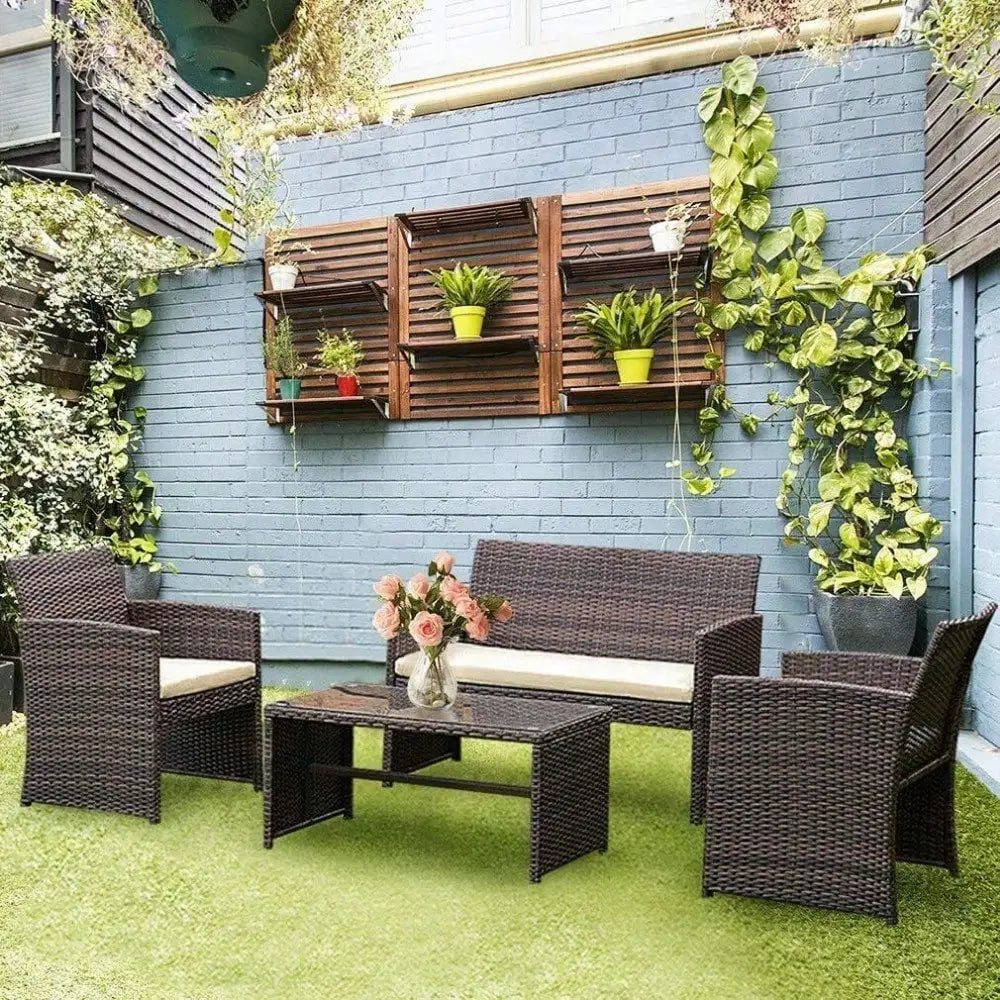 4-piece outdoor rattan patio set with chairs and table